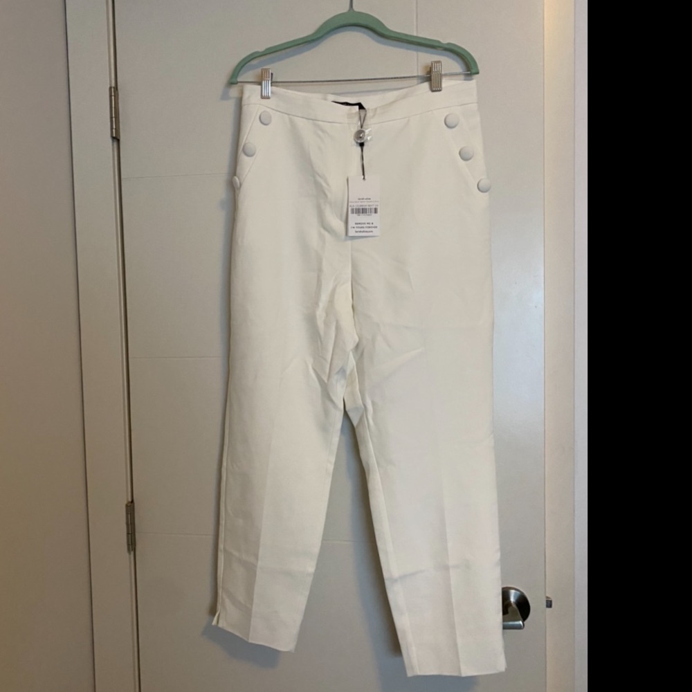 White tailored pants with button detail